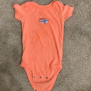Salmon colored onesie